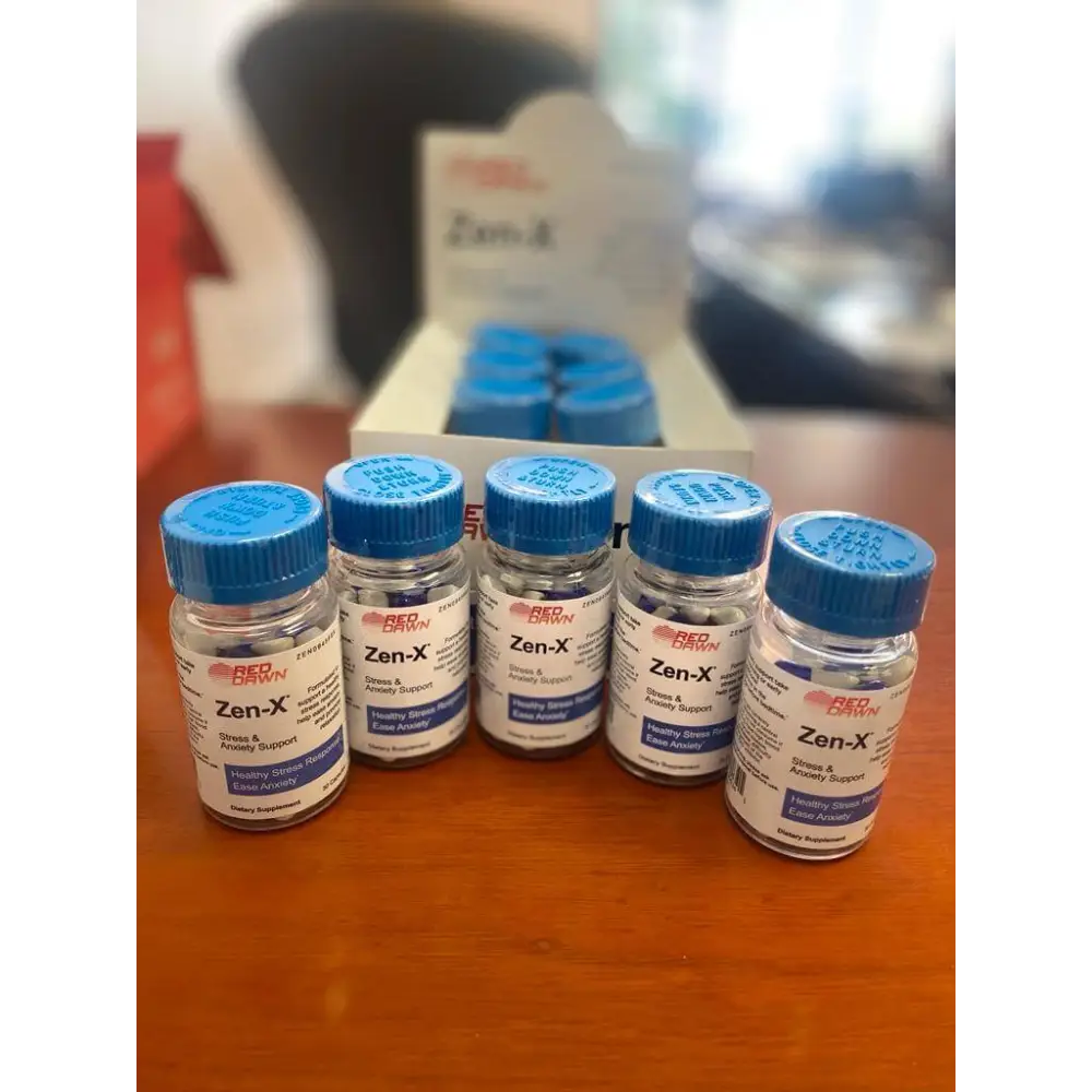 ZEN-X Stress & Anxiety Support capsules 2 bottles and box displayed on a wooden table.