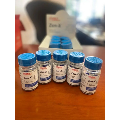 ZEN-X Stress & Anxiety Support capsules 2 bottles and box displayed on a wooden table.